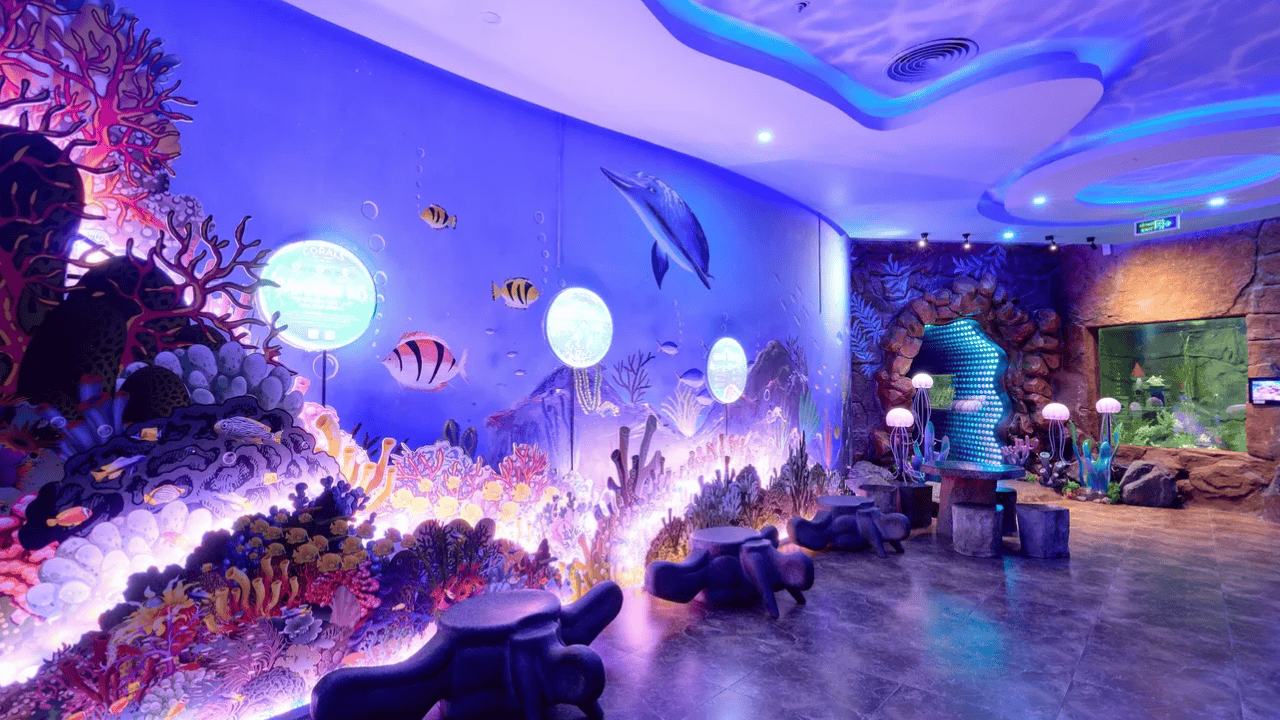 Guests can marvel at the dazzling array of vividly colored corals and the lively marine life that inhabit this meticulously recreated underwater oasis